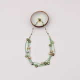 Suede Strips w Pearl Necklace